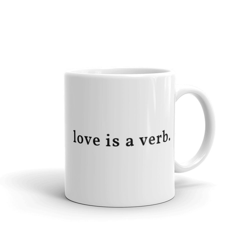 love is a verb. Coffee Mug